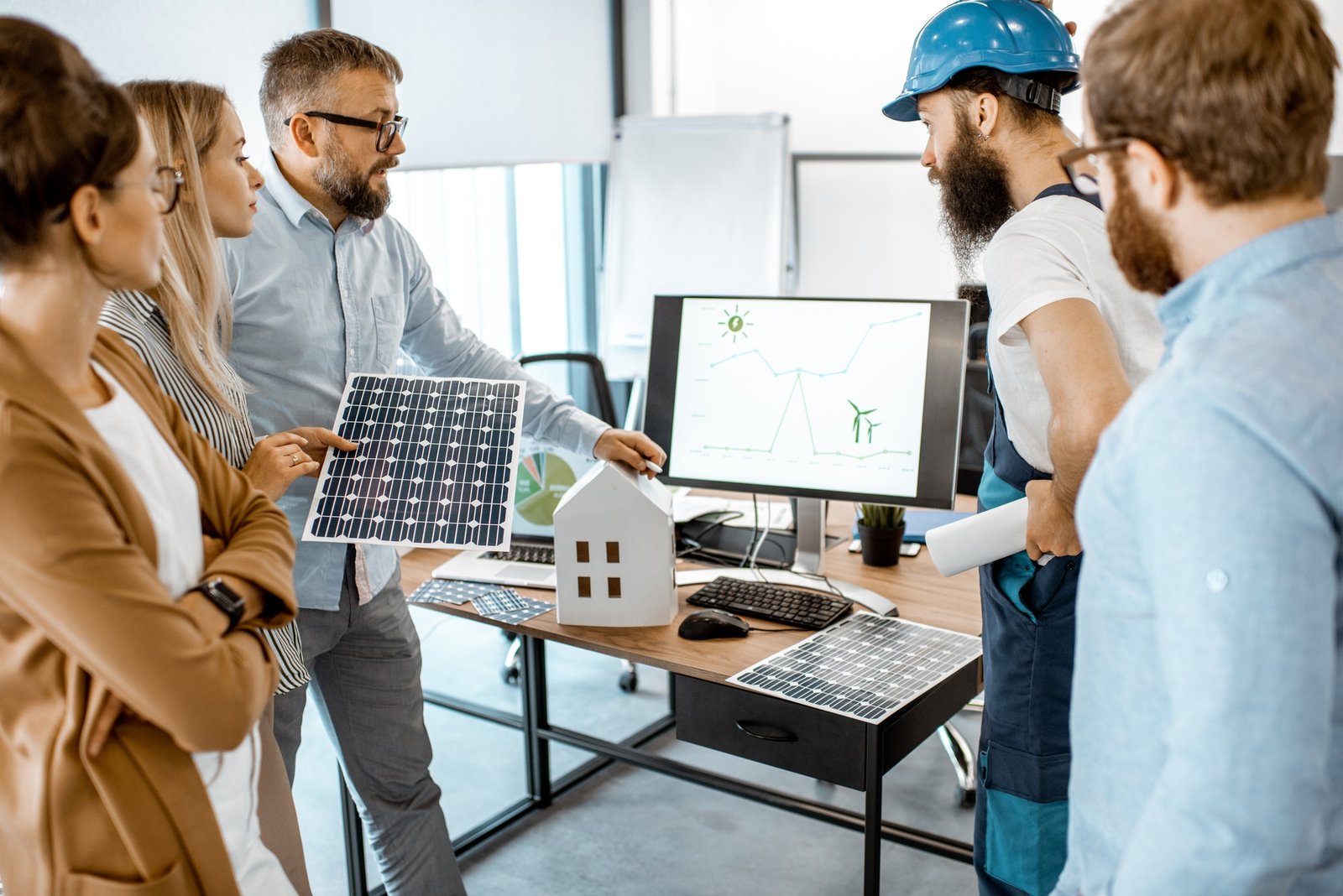 people-working-on-alternative-energy-project-in-the-office.jpg